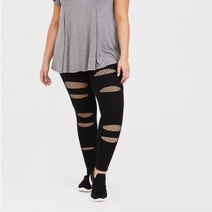 Black ripped fishnet leggings